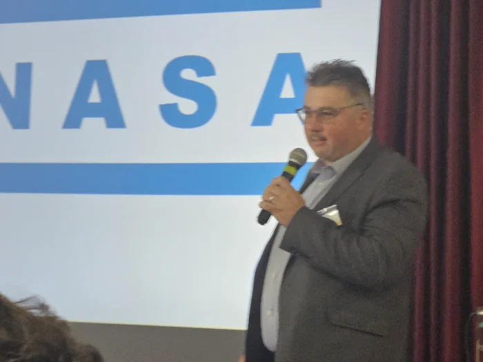 portrait-serious-middle-age-bearded-male-dressed-plaid-flannel-shirt-grey-background